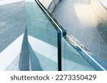 Small photo of Closeup frameless laminated glass railing for exterior installation.