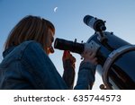 Small photo of Girl looking at the Moon through a telescope. My astronomy work.