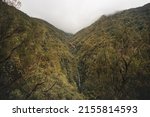 Small photo of Waterfall around the levada faja do rodrigues trail on the island of Madeira, Portugal. A waterfall in the middle of an inescapable nature. Discovering a Portuguese island in the Atlantic Ocean.
