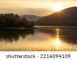 Beautiful sunset over the danube river from Visegrád Hungary with hills and rocks