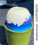 Small photo of blue striped easter egg in eggcup