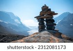 Small photo of Inukshuk with view of the Athabasca glacier in Alberta.