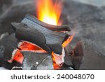 Burning of charcoal grill for BBQ party