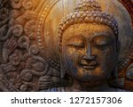 Rock Buddha statue with sunlight used for amulets of Buddhism religion. Buddhism is popular region in China Japan and south east Asia.copy space concept.