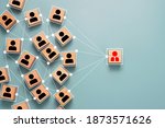 Small photo of Wooden cube block print screen person icon which link connection network for organisation structure social network and teamwork concept.