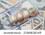 FED wording with up and down arrow on USD dollar banknote for Federal reserve increase and decrease interest rate control which effect to America and world economic growth concept.