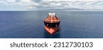 Small photo of Aerial drone ultra wide panoramic photo with copy space of huge bulk carrier tanker anchored in deep blue Aegean sea