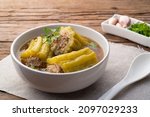 Small photo of Stuffed bitter gourd with seasoned minced pork soup and Glass Noodles (Gang Jeud Mara Sai Moo).Selective focus