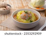 Small photo of Chinese Cabbage Soup with Minced Pork .Stuffed Cabbage with Seasoned minced pork and carrot in white bowl.(Kaeng Chuet Kalampri Yad Sai)