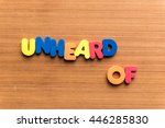 Small photo of unheard of colorful word on the wooden background