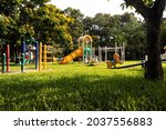 A children Colorful playground on yard in the park. the green grass