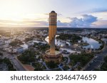 Small photo of Aerial View Roi et tower or Vote Tower 101 and Bung Plan Chai This park in the middle of Roi Et's lake in the city center in sunset time,Province Roi Et Thailand.