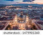 Budapest, Hungary - Aerial view about the towers of the famous St.Stephen's Basilica and Buda Castle, Chain Bridge, Matthias Church at cloudy sunset