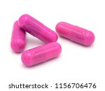 pink  pill capsule on white background