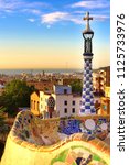 Small photo of Barcelona, Spain: Park Guell. View of the city from Park Guell in Barcelona sunrise. Park Guell by architect Antoni Gaudi