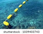 Yellow Buoy On The Sea With...
