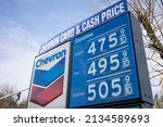 Small photo of West Linn, OR, USA - Mar 11, 2022: Closeup of the gas price sign seen at a Chevron gas station in West Linn, Oregon. Oil and gas prices are soaring due to Russia's war in Ukraine.