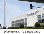 Small photo of Hawthorne, CA, USA - May 10, 2022: Exterior view of the SpaceX headquarters with recovered Falcon 9 rocket booster on display in Hawthorne, California. SpaceX is an American aerospace manufacturer.