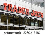 Small photo of Boston, MA, USA - June 30, 2022: Trader Joe's sign is seen at its store in the Allston neighborhood of Boston. Trader Joe's is an American grocery store chain headquartered in Monrovia, California.