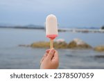Close up of a femal hand holding ice cream 