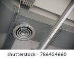High resolution photo of circular air duct and Ventilation pipe of air conditioning system (HVAC) hanging from ceiling inside building. Danger and the cause of respiratory diseases in office staff.