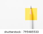 Minimalist template with copy space by top view close up macro photo of wooden yellow pencil isolated on white texture paper and combine with yellow square. Flash light made smooth shadow from pencil.