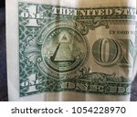 bent and wrinkled one dollar... | Shutterstock . vector #1054228970