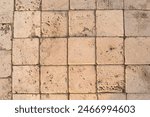 The detail of worn stone paving ...