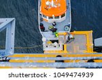 Small photo of Schleswig Holstein - North Sea, Germany - January 06, 2018: Wind energy company repower is building a wind farm in Schleswig Holstein - North Sea, by Natascha Kaukorat
