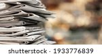 Small photo of Pile of newspapers stacks on blur background