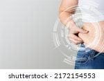 Skinny fat woman figure touches stomach. Abdominal fat and dieting concept. Massaging marks.