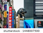 Small photo of Tokyo, Japan - May 10, 2019: At Godzilla’s hometown of Tokyo, a giant Godzilla Head of the scaly menace is towering over the Toho Building in the Shinjuku Ward.