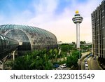Small photo of Singapore - May 25, 2023 : Exterior view of Jewel Changi and Airport Control Tower. Jewel Changi Airport is a mixed-use development at Changi Airport in Singapore, opened in April 2019.