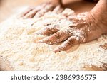 Hands baker with flour in...
