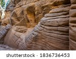 Lick Wash is a slot canyon whose rock walls are formed by water erosion from flash floods at Grand Staircase-Escalante National Monument in Kane County, Utah.