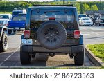 Small photo of Pigeon Forge, TN - August 25, 2017: Lightly Modified Off Road Jeep Wrangler JK Sahara Unlimited at a local enthusiast rally.