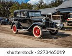 Small photo of Fort Meade, FL - February 26, 2022: Wide angle front corner view of a 1930 Ford Model A Tudor Sedan at a local car show.