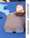 Small photo of First aid training. Cardiac massage. Cardiopulmonary resuscitation - CPR training.