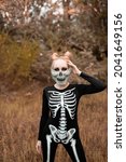 Girl Dressed As A Skeleton In...