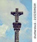 Small photo of Stone cross in Muxia on the Camino de Santiago, Galicia, Spain. These symbols were built from the seventeenth century to sanctify the roads and pilgrims.