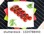 a bunch of cherry tomatoes laid ... | Shutterstock . vector #1324788443