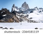 Small photo of Travelers couple in love enjoying the view of majestic Mount Fitz Roy - symbol of Patagonia, Argentina