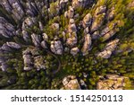 Adrspach rocks at sunset. Aerial top down view of trail path in rock formations, cliffs and trees of Adrspach Teplice rocks national park. Adrspach, Bohemia, Czech Republic, Czech mountains landscape.