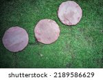 Top view group of sand stones in round shape place on the lawn field at the outdoor garden