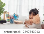 Child playing with teddy bear....