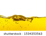 Small photo of Beautiful wave of high viscosity of base oil and air bubble inside the oil isolated on white background. Used in automotive and industrial application. Used as wallpaper, industrial concept