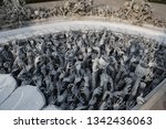 Small photo of Hands of people pulled with entreaty. Wat Rong Khun (White Temple) in Chiang Rai city, Thailand. Religious traditional national Thai architecture. Landmark, architectural monument of Chiang Rai. Money