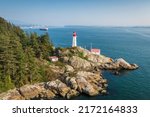 Aerial view of historic landmark Point Atkinson Lighthouse by day in West Vancouver, British Columbia, Canada.
