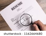 Small photo of Resume close-up. The concept of false information about yourself when applying for a job, when writing a resume. Lies and deceit concept