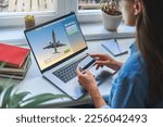 Online booking and buying plane tickets using computer and credit card